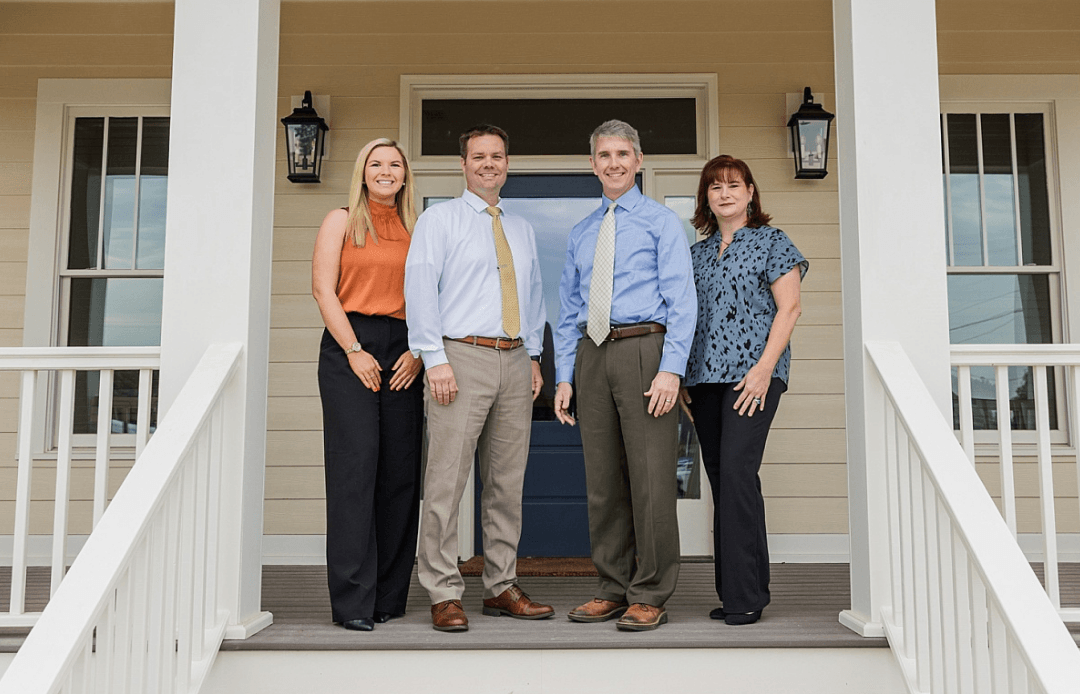 People standing on a front porch 